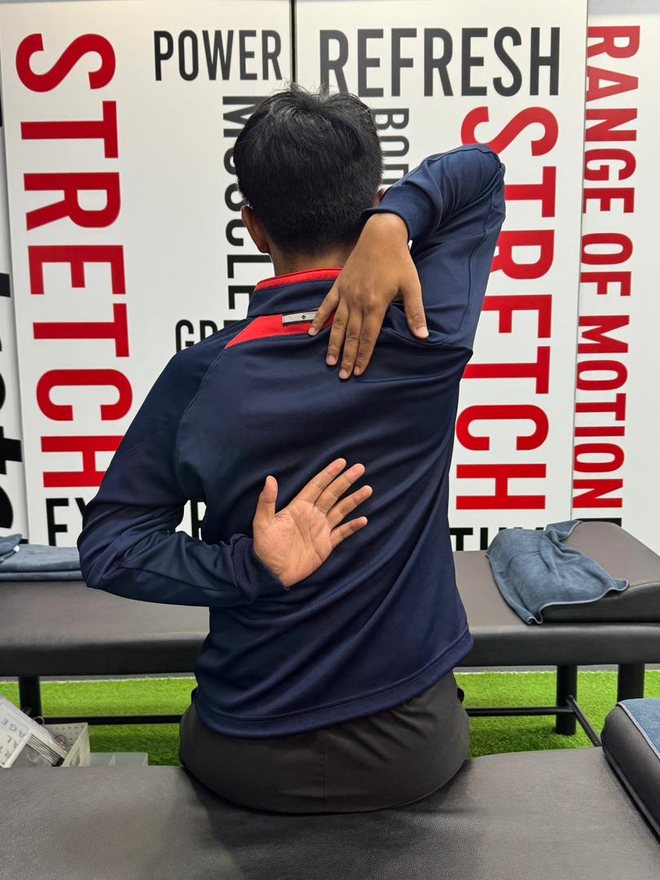 Before — hands could not meet behind the back
